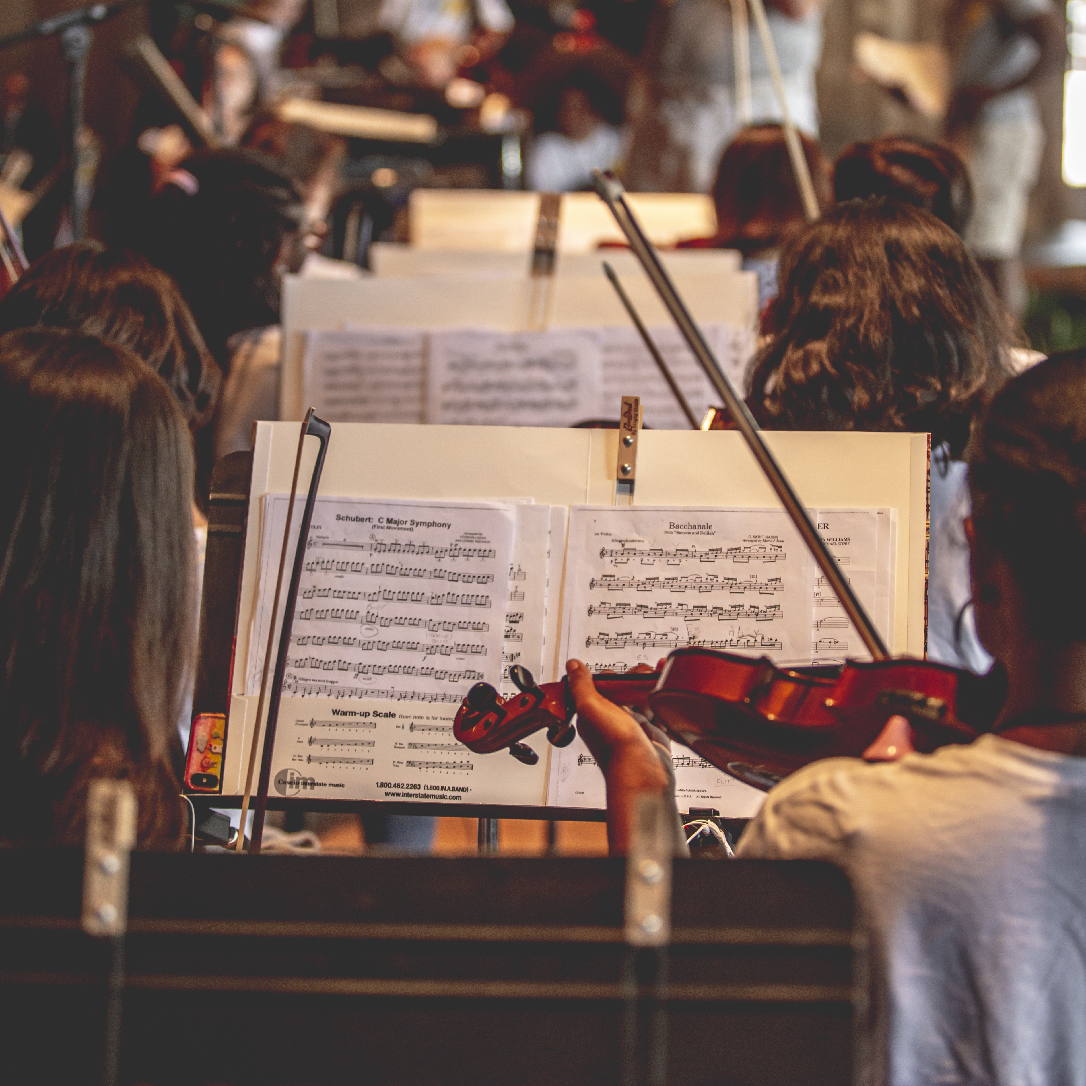 Violinists rehearsing at the Mann