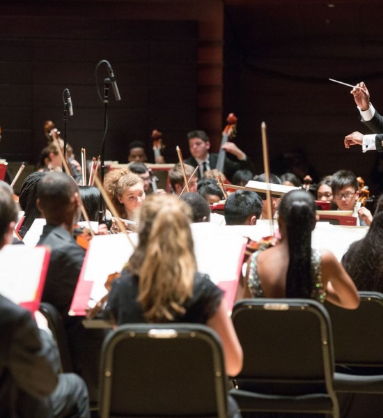 Joseph Conyers directing All City Orchestra