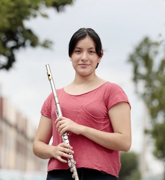 Ariadna Rosas photographed with her flute for ACOSA 2020